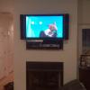 This used to be a giant pocket about the fireplace for an old tube TV. We mounted the TV and placed all the equipment creating the look of a custom recessed shelf that houses all the equipment